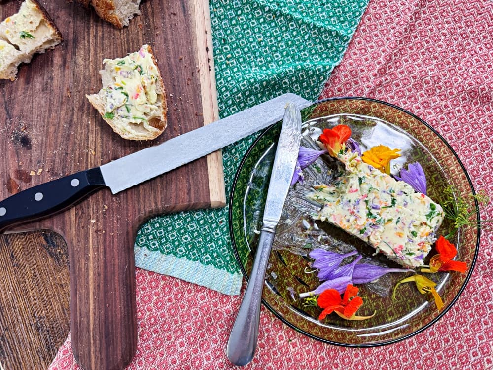 block of butter on plate with flowers