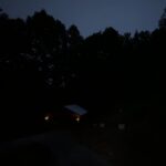 dark night with outdoor lights shining