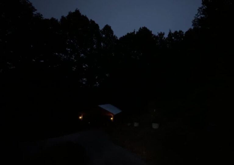 dark night with outdoor lights shining
