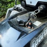 small toy monkey on 4 wheeler